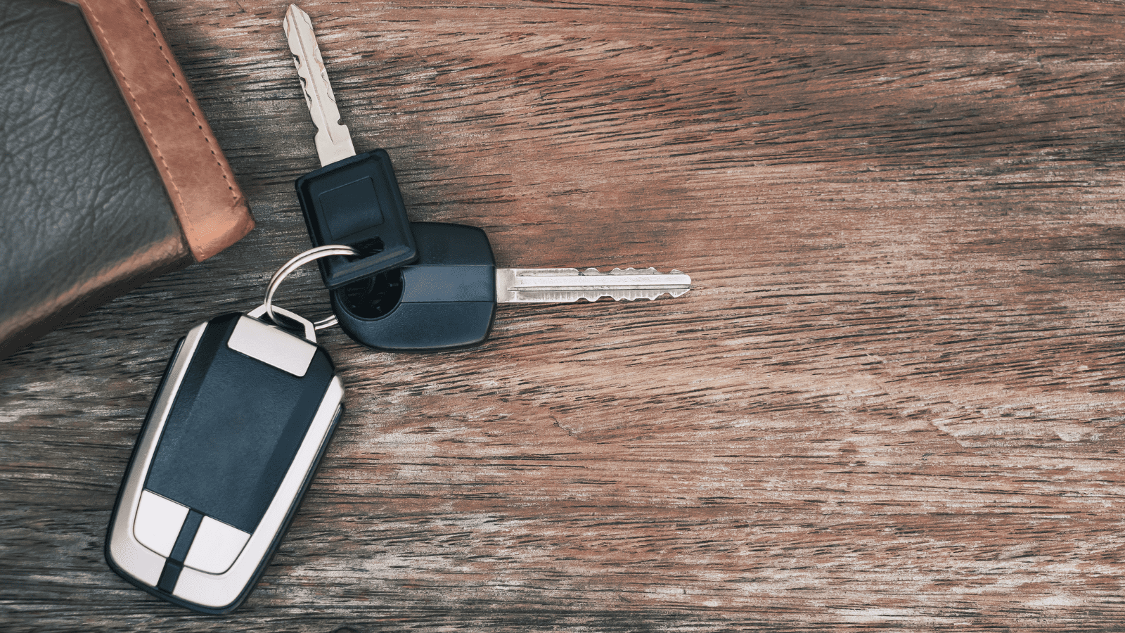 Vehicle Donation car keys on wooden desktop