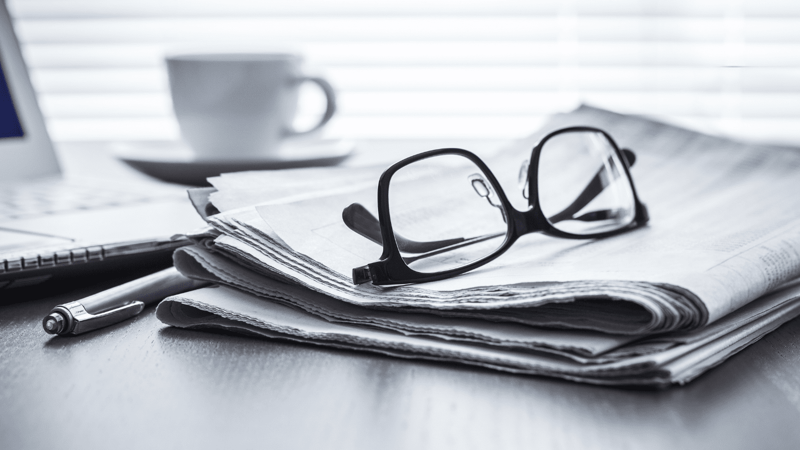 newspaper-and-glasses glasses on a newspaper