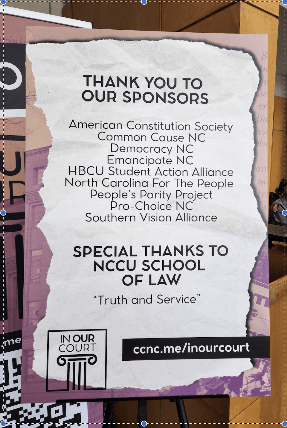 A sign thanking the many sponsors of the "In Our Courts" event taking place at NCCU.